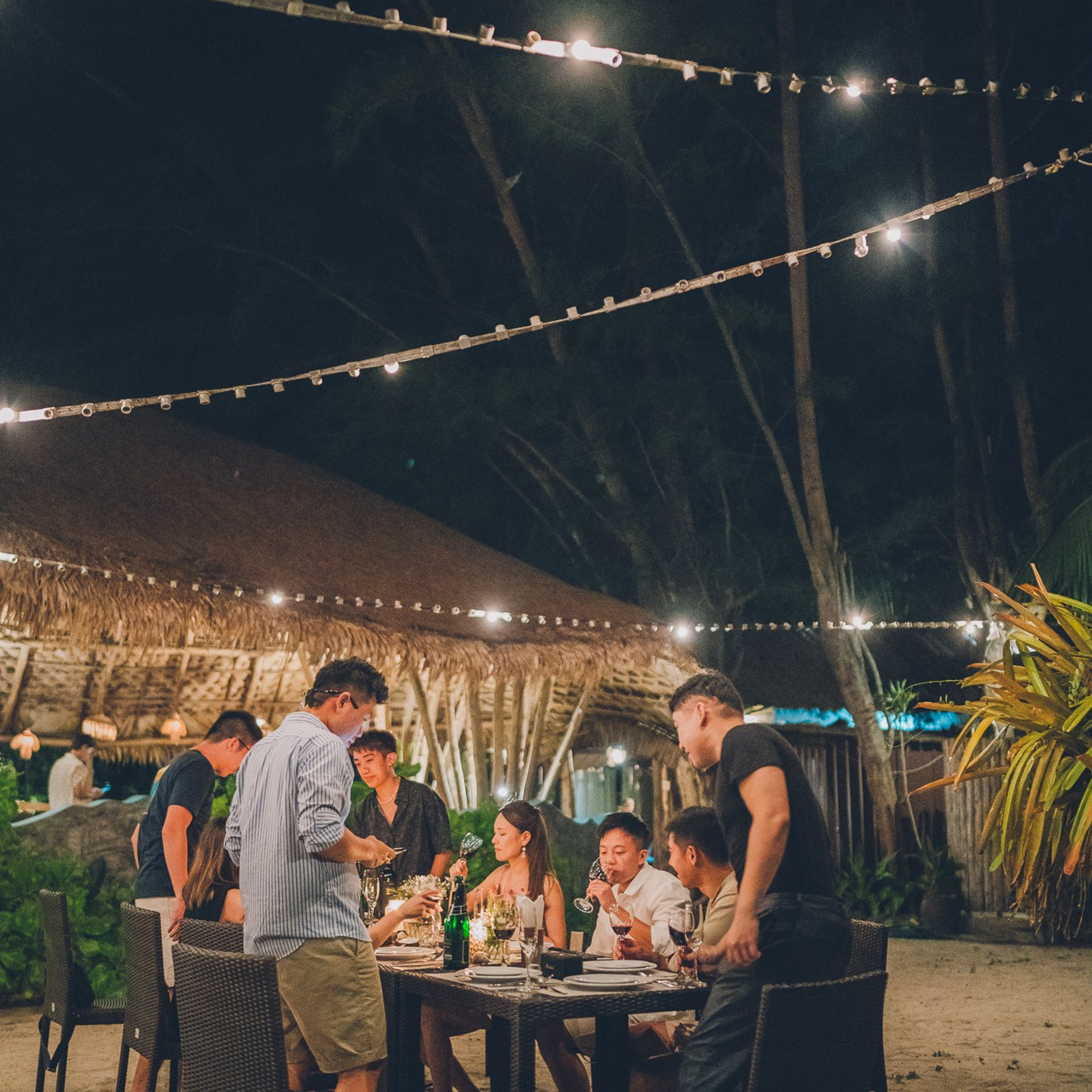 Luxury beach proposal in Koh Samui, Thailand. Private sunset setup with candles, flowers, and ocean view for an unforgettable engagement experience.