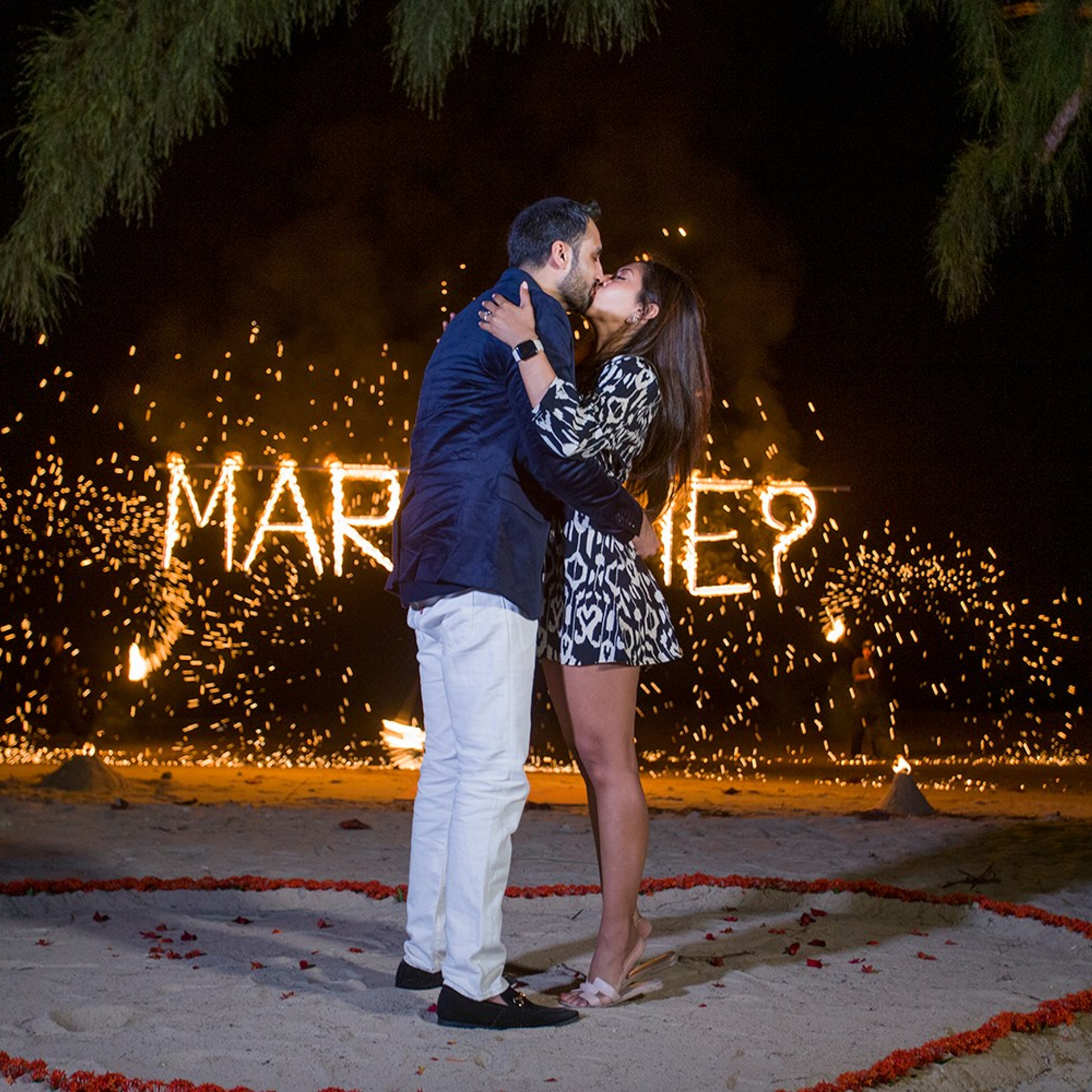Luxury beach proposal in Koh Samui, Thailand. Private sunset setup with candles, flowers, and ocean view for an unforgettable engagement experience.