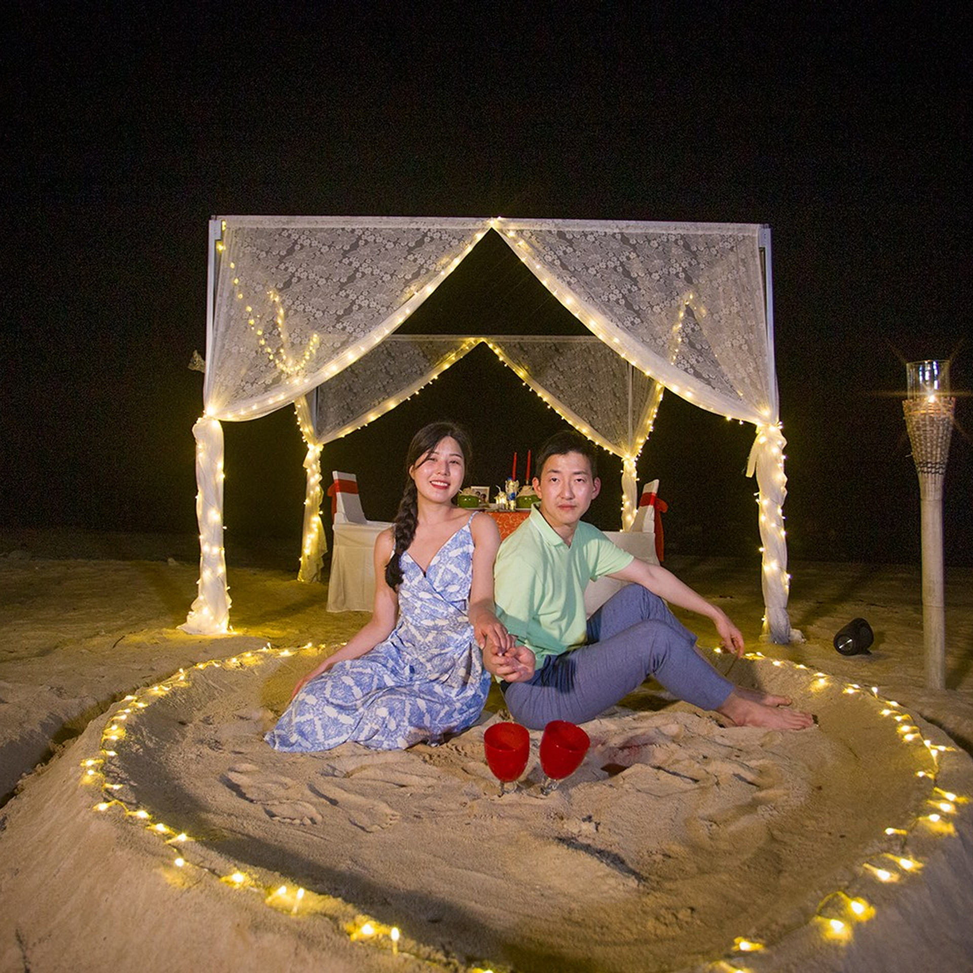 Luxury beach proposal in Koh Samui, Thailand. Private sunset setup with candles, flowers, and ocean view for an unforgettable engagement experience.