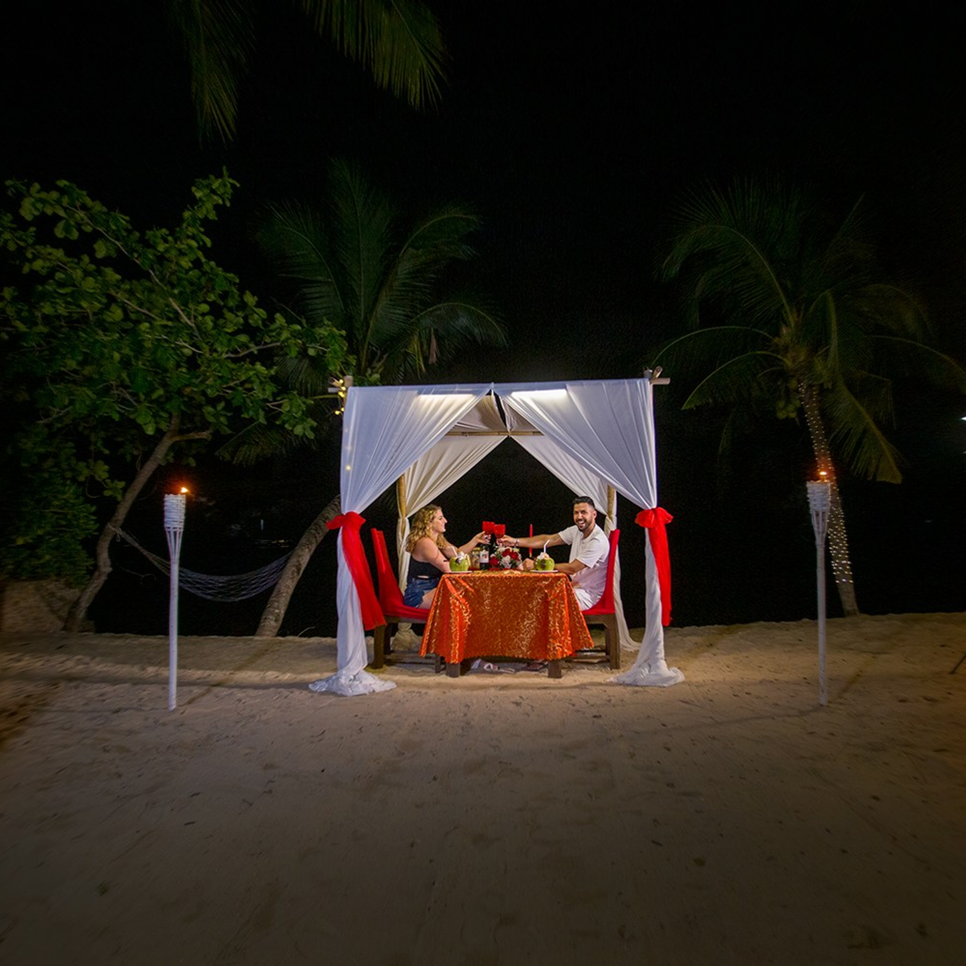 Luxury beach proposal in Koh Samui, Thailand. Private sunset setup with candles, flowers, and ocean view for an unforgettable engagement experience.