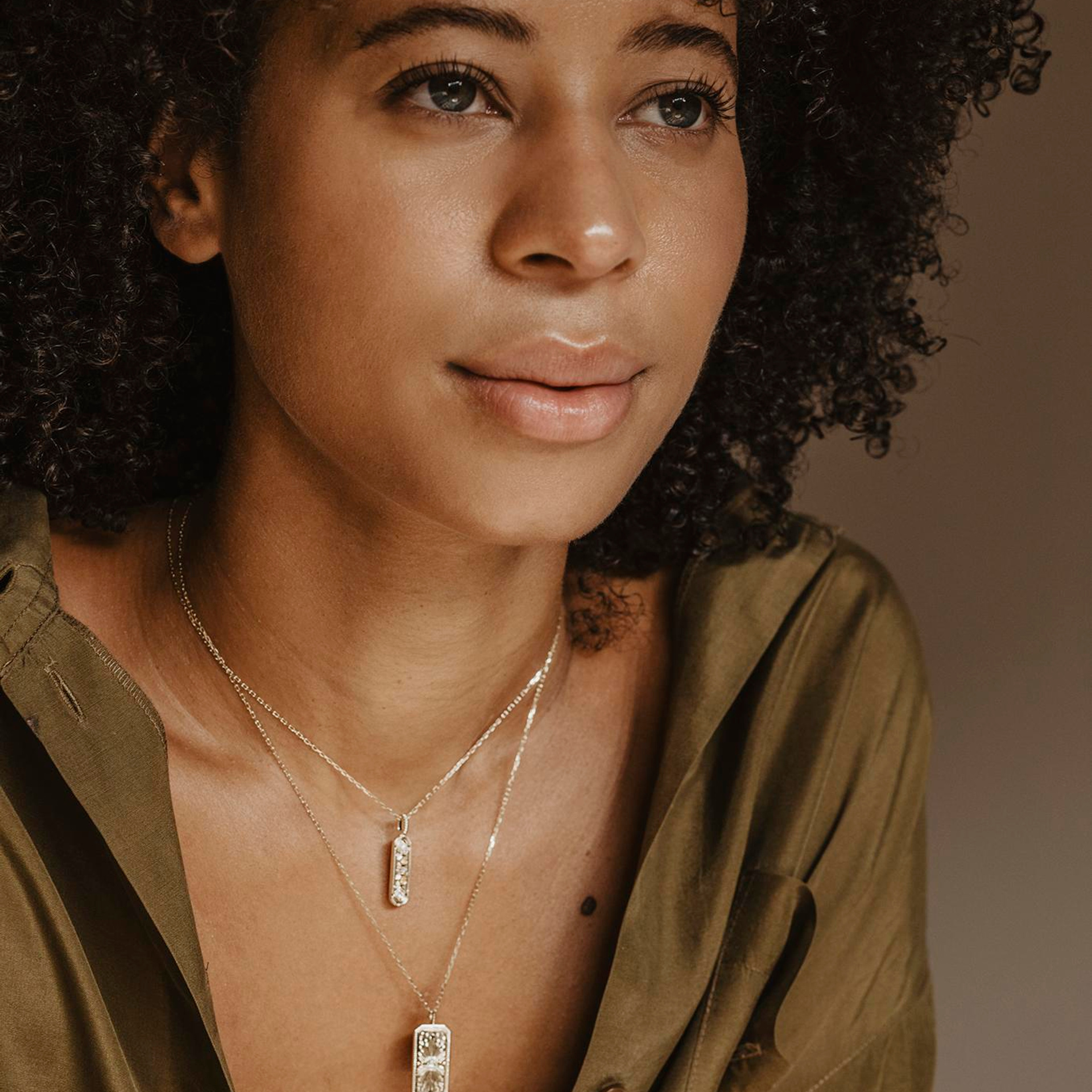 lose-up portrait of woman with necklace in warm light - portrait photography CDMX