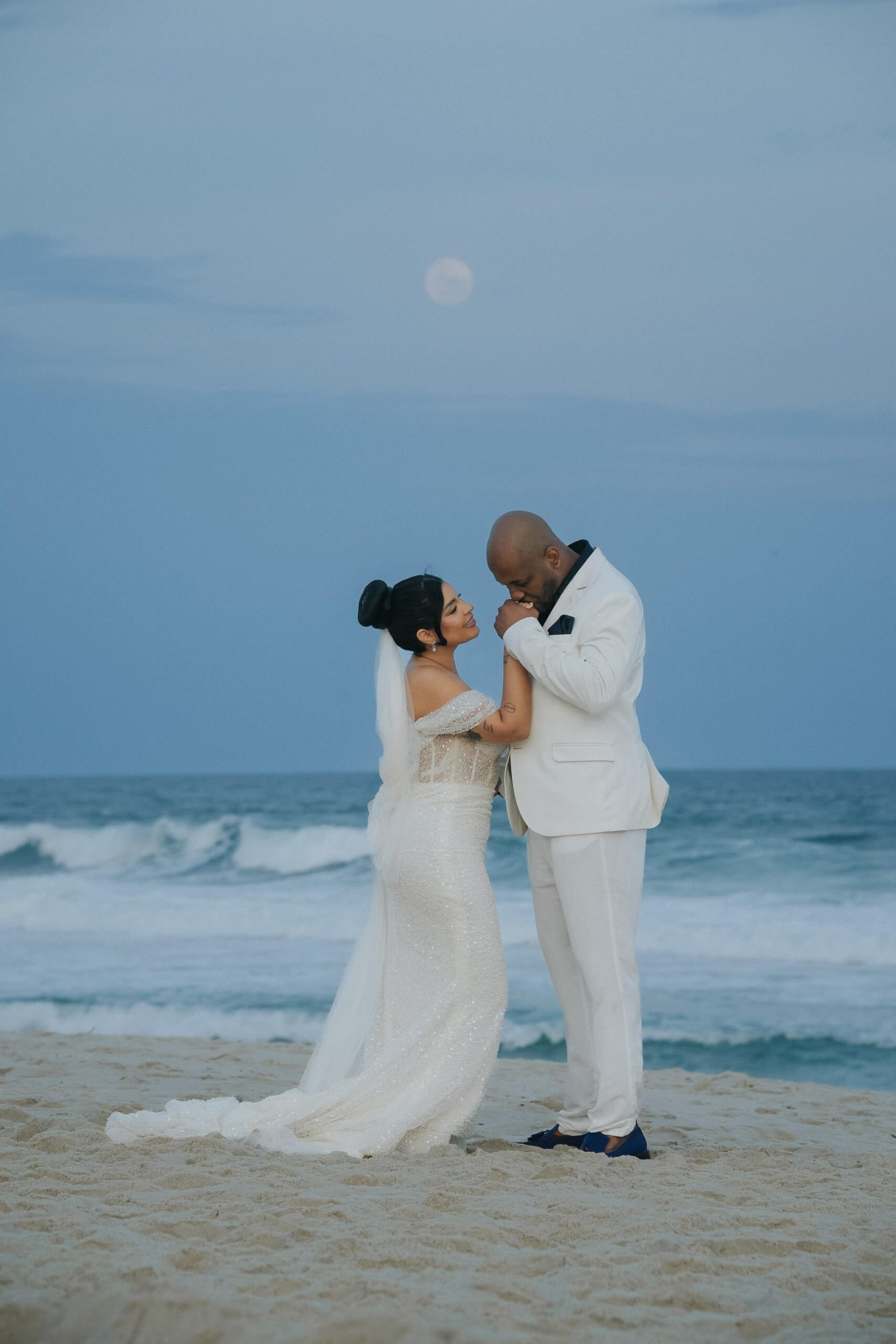 Intimate elopement wedding with couple on the beach in Rio de Janeiro, romantic destination wedding in Brazil.